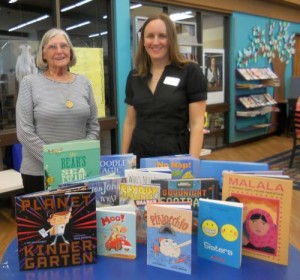 Feather river Chapter Librarian Charlene Peery presents donated books to Sarah Vantrease (on the right), Librarian for the Butte County Library in Oroville